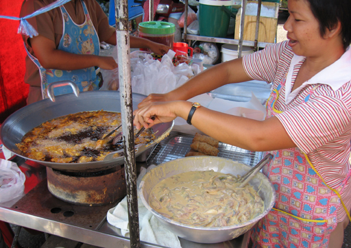 Frying fish at the market