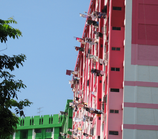 Laundry hanging from apartment block windows